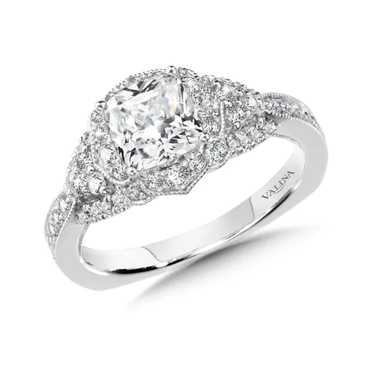 Diamond halo engagement ring mounting in 14k white gold.